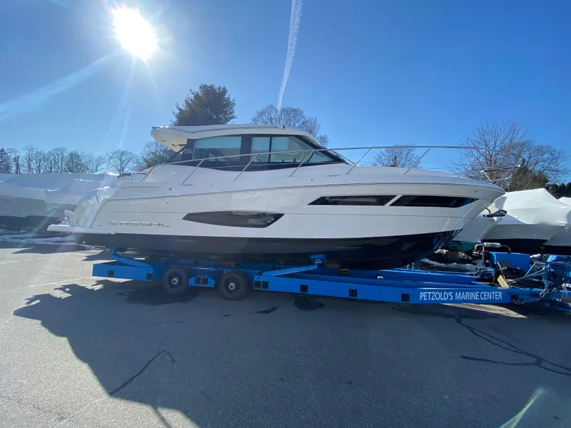 Slide: The Image of 2024 Regal 38XO yacht on trailer at Petzold's Marine Center. - 24