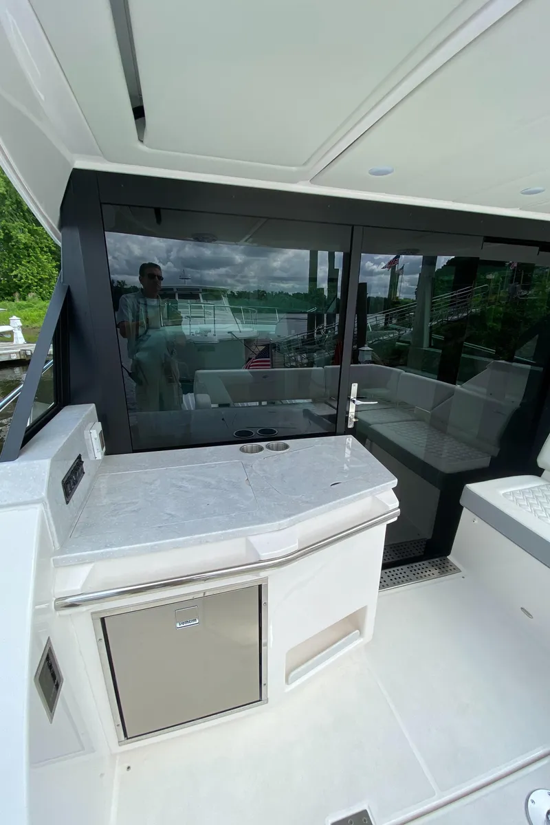 Slide: The Image of 2024 Regal 38XO yacht interior with sleek design and modern amenities. - 7