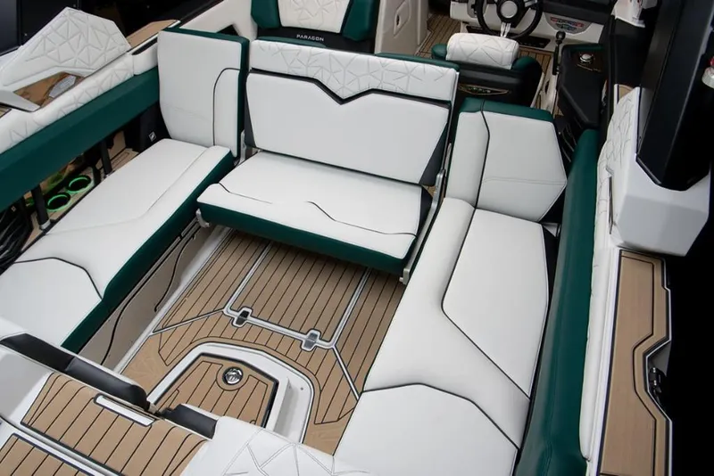 Slide: The Image of 2023 Nautique Super Air Nautique G23 Paragon interior with luxurious seating and teak flooring. - 11