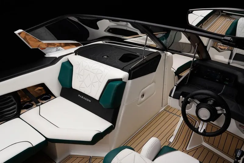 Slide: The Image of 2023 Nautique Super Air Nautique G23 Paragon interior, luxury boat seating and dashboard. - 12
