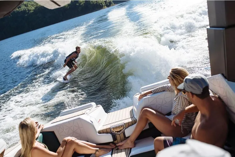 Slide: The Image of 2023 Nautique Super Air Nautique G23 Paragon with people wake surfing. - 20