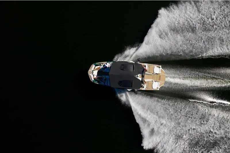 Slide: The Image of Aerial view of 2023 Nautique Super Air Nautique G23 Paragon boat on water. - 24