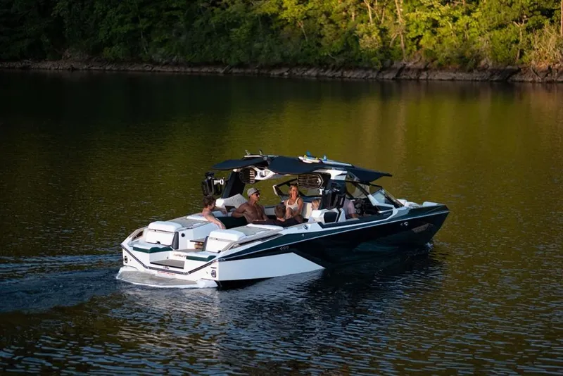 Slide: The Image of 2023 Nautique Super Air Nautique G23 Paragon cruising on a serene lake. - 3