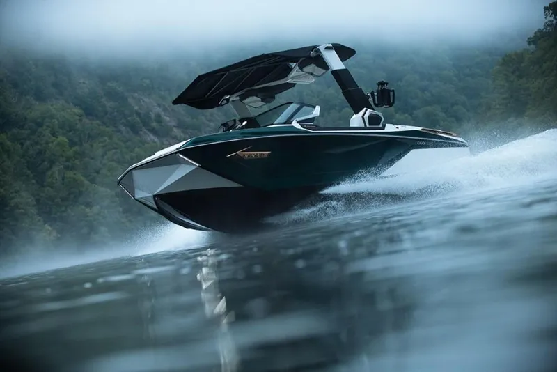 Slide: The Image of 2023 Nautique Super Air Nautique G23 Paragon speeding on a misty lake. - 5