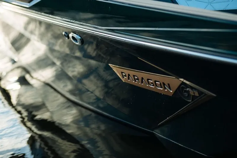 Slide: The Image of 2023 Nautique Super Air Nautique G23 Paragon boat side view on water. - 8