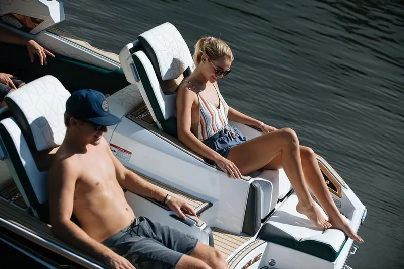Slide: The Image of 2023 Nautique Super Air Nautique G23 Paragon with passengers relaxing on deck. - 9
