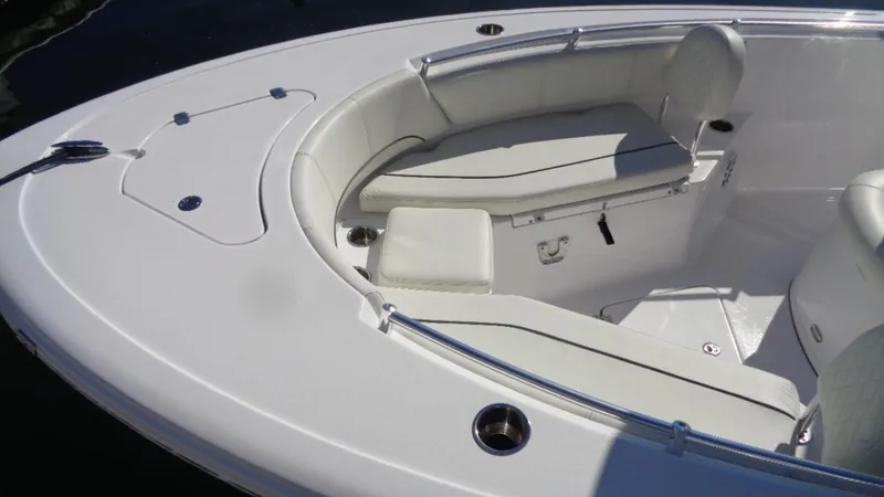 Slide: The Image of 2018 Sportsman 232 Open boat interior with cushioned seating and storage compartments. - 12