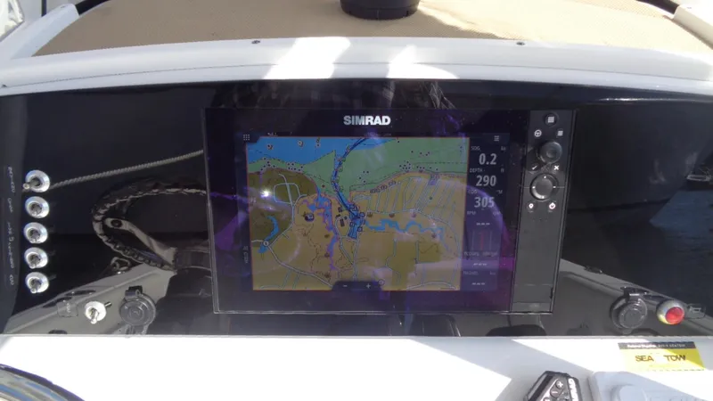 Slide: The Image of Simrad navigation system on 2018 Sportsman 232 Open boat dashboard. - 14