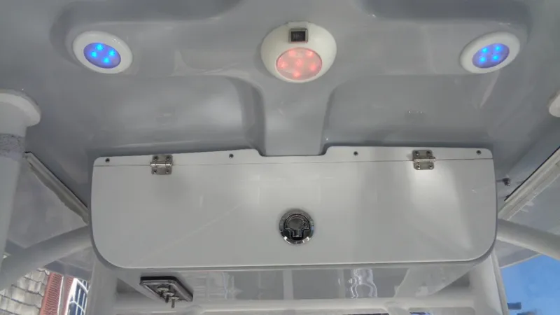 Slide: The Image of 2018 Sportsman 232 Open boat interior with LED lights and storage compartment. - 16