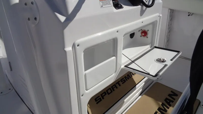 Slide: The Image of 2018 Sportsman 232 Open boat console with storage compartments and control panel. - 17