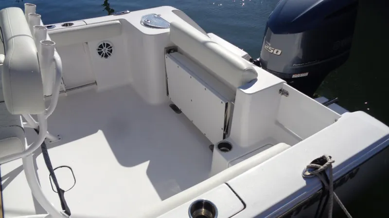 Slide: The Image of 2018 Sportsman 232 Open boat interior with seating and outboard motor. - 4