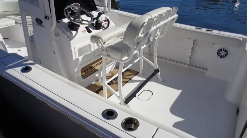 Slide: The Image of 2018 Sportsman 232 Open boat interior with seating and steering console. - 6