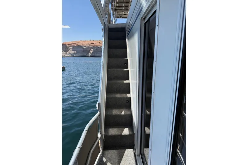 Slide: The Image of Staircase on 2004 Stardust Cruisers San Juan Sunrise Trip 24, overlooking serene waters. - 12