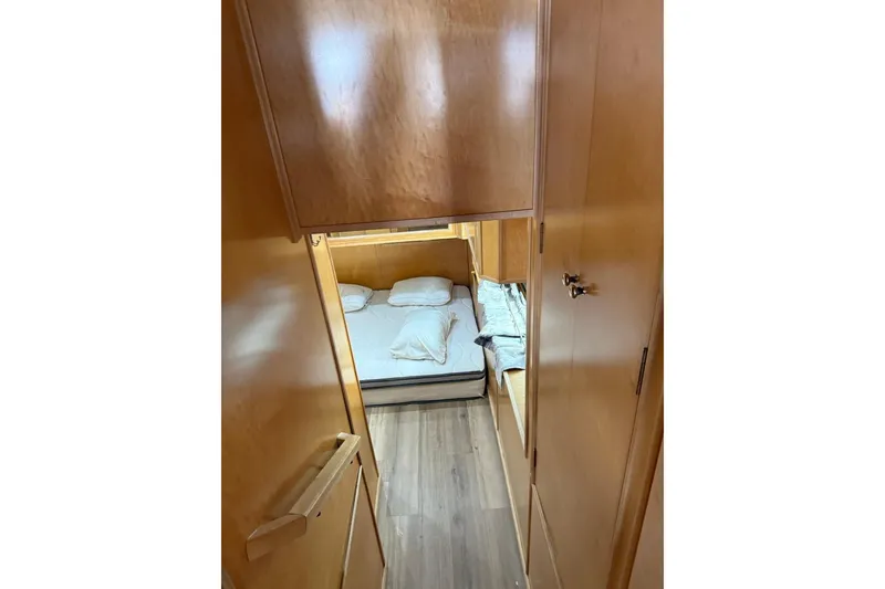 Slide: The Image of Interior cabin view of 2004 Stardust Cruisers San Juan Sunrise Trip 24, featuring cozy bedding. - 5