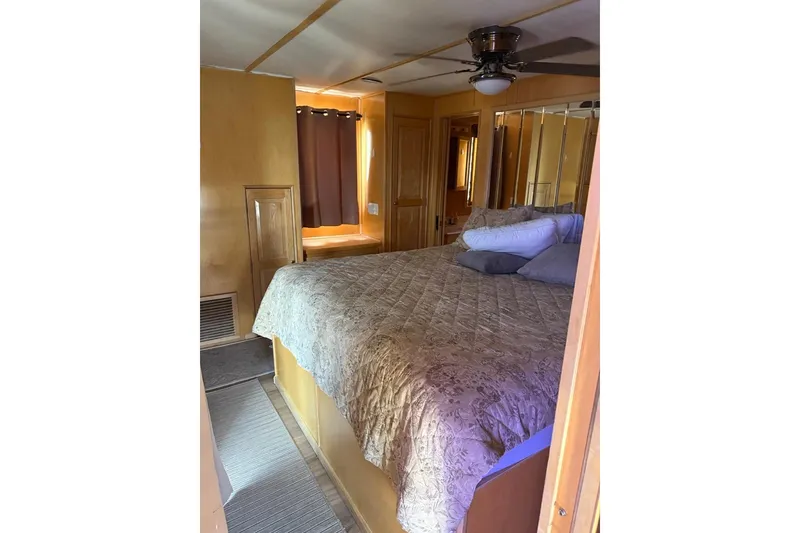 Slide: The Image of Cozy bedroom interior of 2004 Stardust Cruisers San Juan Sunrise Trip 24 houseboat. - 7