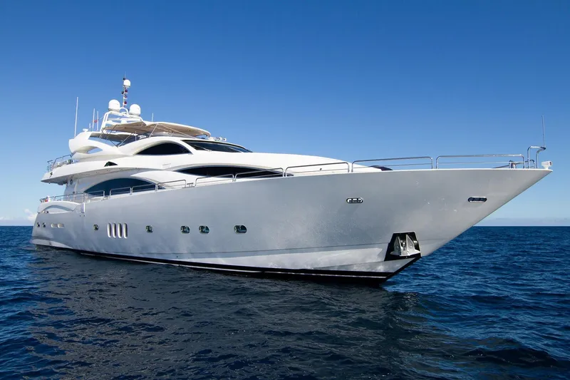 The Image of Luxurious 2002 Sunseeker 105 Yacht cruising on open sea under clear blue sky. - 0