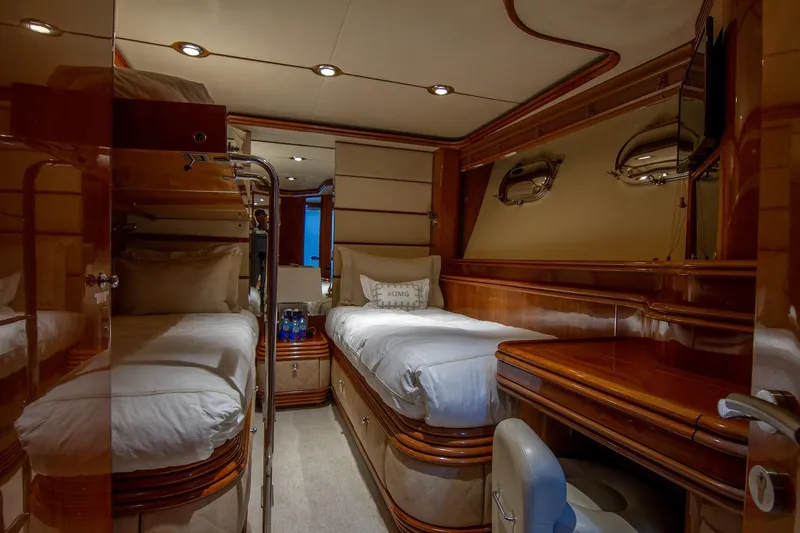 Slide: The Image of Luxurious cabin interior of 2002 Sunseeker 105 Yacht with twin beds and elegant wood finish. - 17