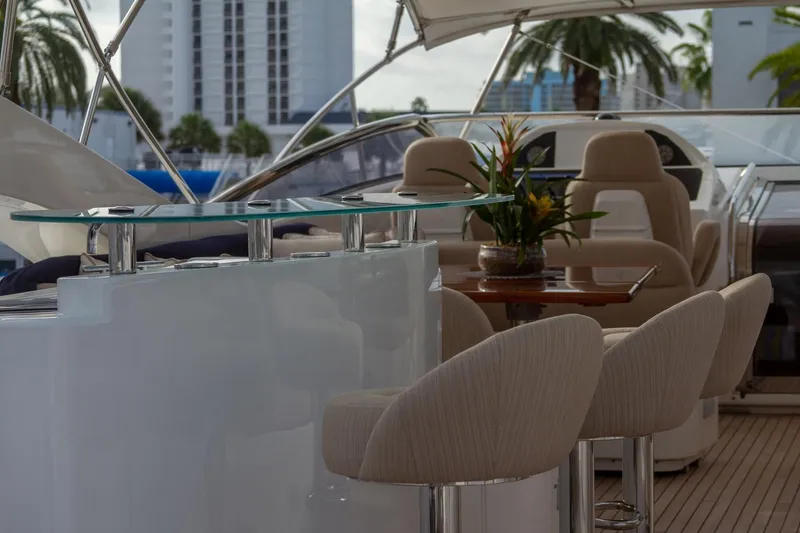 Slide: The Image of Luxurious Sunseeker 105 Yacht interior with elegant seating and tropical decor, 2002 model. - 18