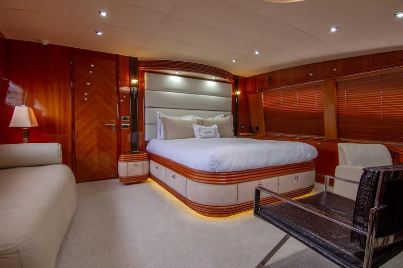 Slide: The Image of Luxurious bedroom interior of 2002 Sunseeker 105 Yacht with elegant wood finishes. - 2
