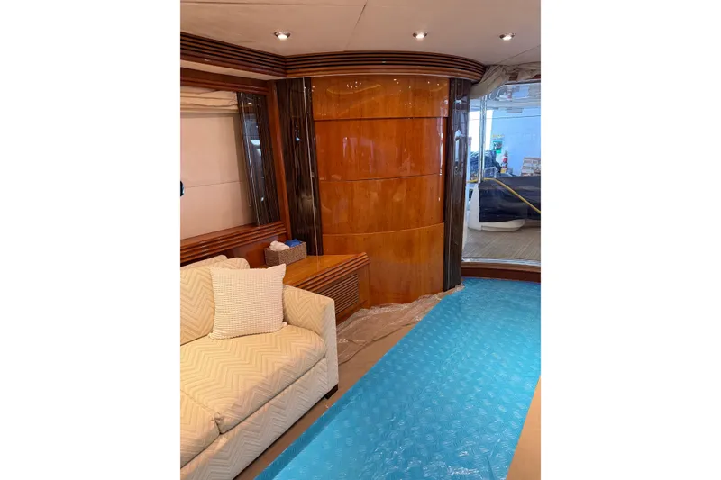 Slide: The Image of Luxurious interior of 2002 Sunseeker 105 Yacht with elegant wood paneling and plush seating. - 27