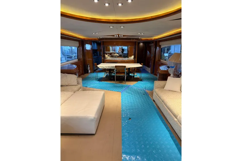 Slide: The Image of Luxurious interior of a 2002 Sunseeker 105 Yacht with elegant seating and dining area. - 29