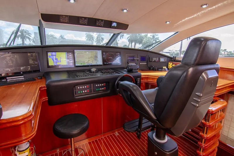 Slide: The Image of Luxurious Sunseeker 105 Yacht 2002 helm with advanced navigation systems and leather captain's chair. - 3