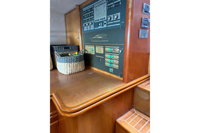 Slide: The Image of Control panel and storage baskets on a 2002 Sunseeker 105 Yacht interior. - 30