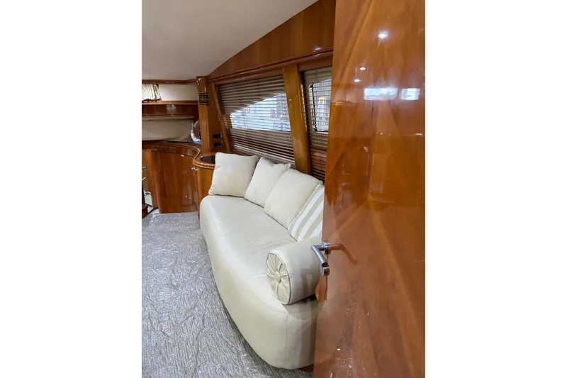 Slide: The Image of Luxurious interior of 2002 Sunseeker 105 Yacht with cream sofa and wooden finishes. - 33