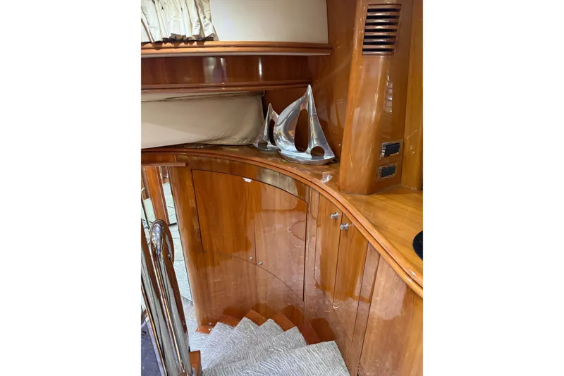 Slide: The Image of Luxurious wooden interior of a 2002 Sunseeker 105 Yacht with elegant decor. - 34