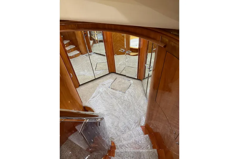 Slide: The Image of Luxurious interior staircase of a 2002 Sunseeker 105 Yacht with mirrored walls. - 35