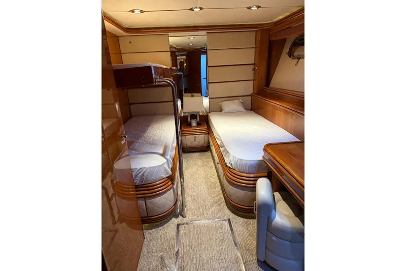 Slide: The Image of Luxurious cabin interior of 2002 Sunseeker 105 Yacht with twin beds and elegant wood finish. - 40