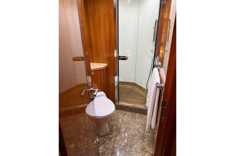 Slide: The Image of Luxurious bathroom on 2002 Sunseeker 105 Yacht with elegant wood and marble finishes. - 41