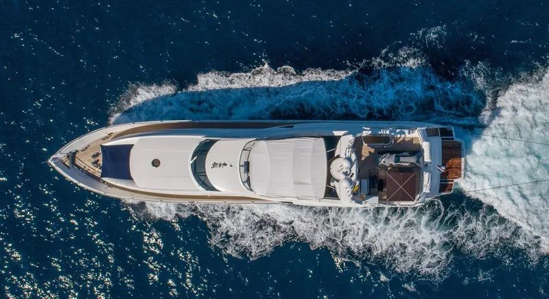 Slide: The Image of Aerial view of 2002 Sunseeker 105 Yacht cruising on open water. - 7