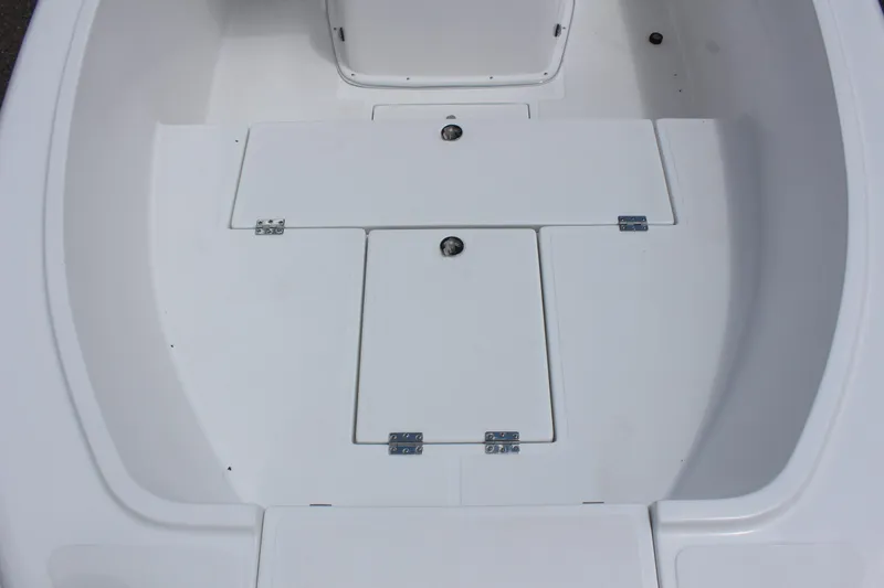 Slide: The Image of Clearwater 2000 CC 2024 boat deck with storage compartments. - 10