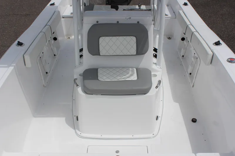 Slide: The Image of 2024 Clearwater 2000 CC boat interior with white and gray seating. - 11