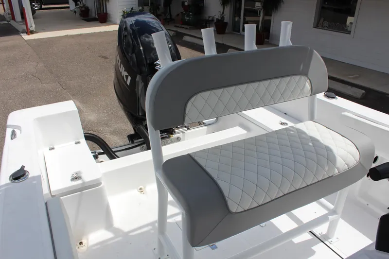 Slide: The Image of 2024 Clearwater 2000 CC boat with Suzuki outboard motor and cushioned seating. - 15
