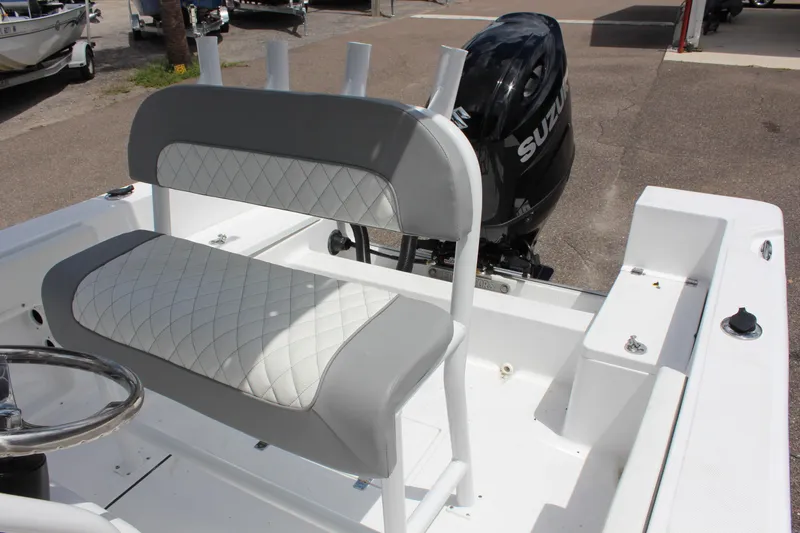 Slide: The Image of 2024 Clearwater 2000 CC boat with Suzuki outboard motor and cushioned seating. - 16