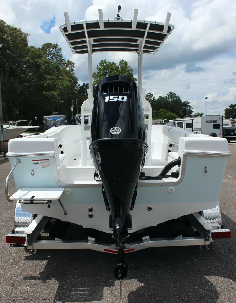 Slide: The Image of 2024 Clearwater 2000 CC boat with a 150 HP outboard motor, rear view. - 19