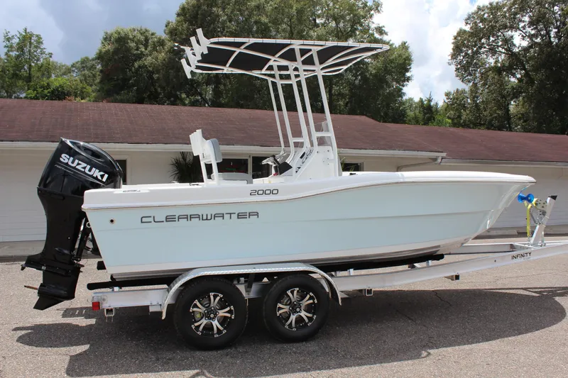 Slide: The Image of 2024 Clearwater 2000 CC boat on trailer with Suzuki outboard motor. - 4