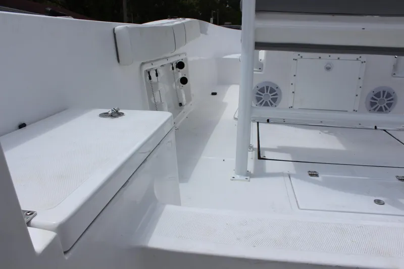 Slide: The Image of Interior of 2024 Clearwater 2000 CC boat, featuring storage compartments and seating. - 7