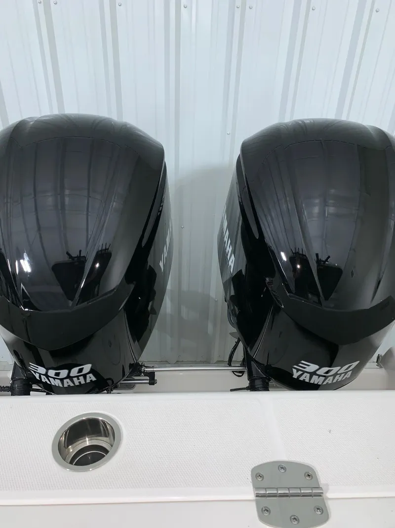 Slide: The Image of 2024 Robalo 302 with twin Yamaha 300 outboard engines. - 21