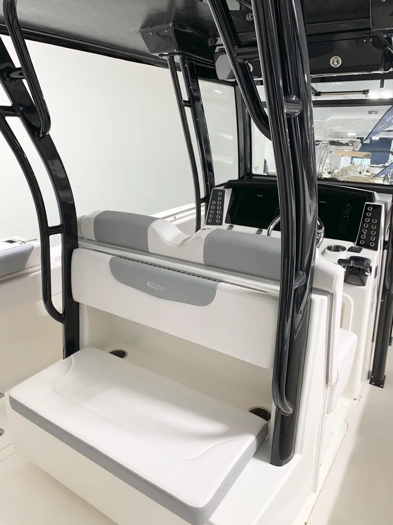 Slide: The Image of 2024 Robalo 302 boat interior with dual seating and modern console. - 6