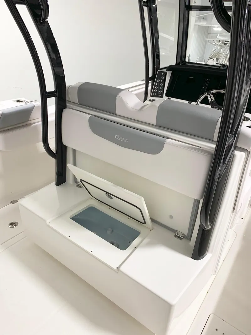 Slide: The Image of 2024 Robalo 302 boat interior with seating and storage compartment. - 7
