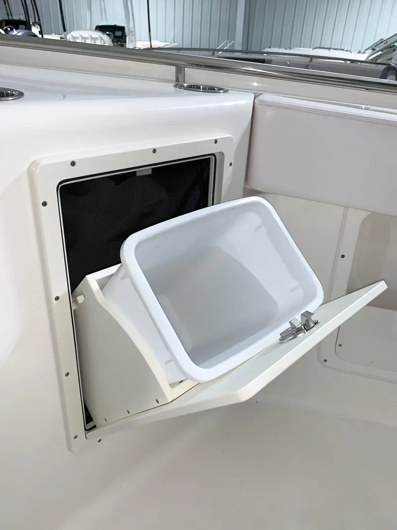 Slide: The Image of Built-in storage compartment on the 2024 Robalo 302 boat. - 17