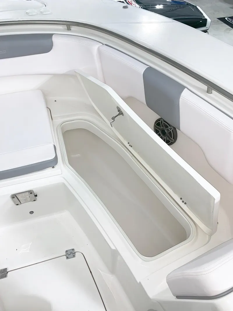 Slide: The Image of 2024 Robalo 302 boat interior storage compartment with open hatch. - 20