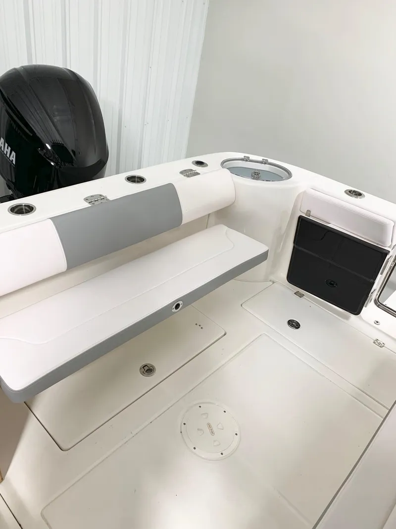 Slide: The Image of 2024 Robalo 302 boat interior with Yamaha engine, seating, and storage compartments. - 4