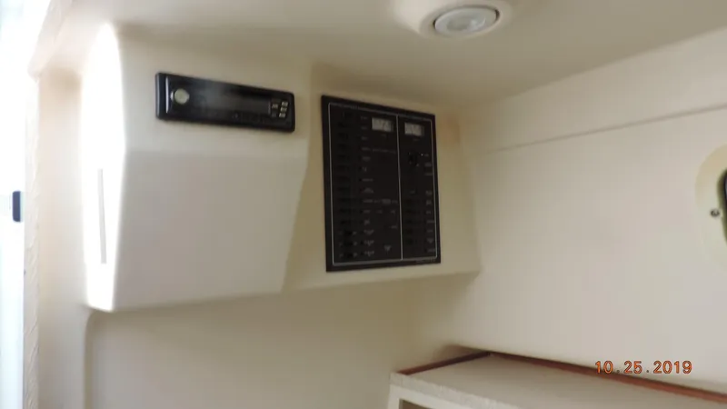 Slide: The Image of 1998 Mainship 30 PILOT interior control panel with modern equipment. - 15