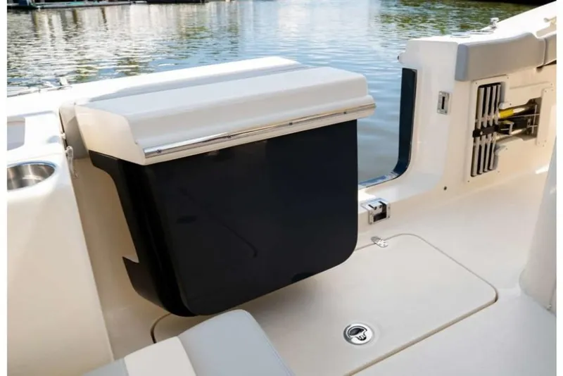 Slide: The Image of 2023 Scout 330 LXF boat interior with storage compartment. - 24