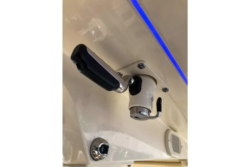 Slide: The Image of 2023 Scout 330 LXF boat control lever with blue LED lighting. - 34