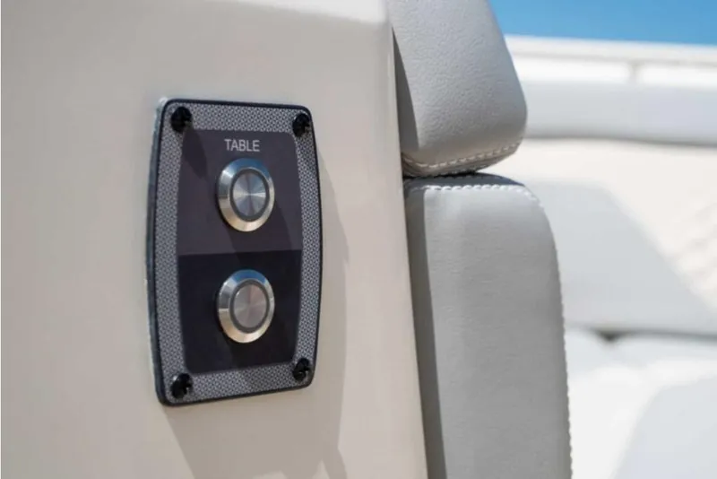 Slide: The Image of Control panel on 2023 Scout 330 LXF boat with table buttons. - 36